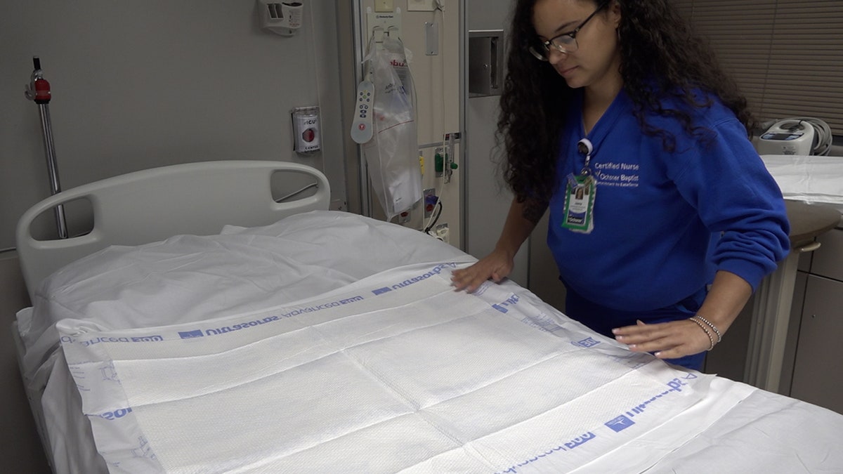 RN Jaime Taylor preps an ICU bed