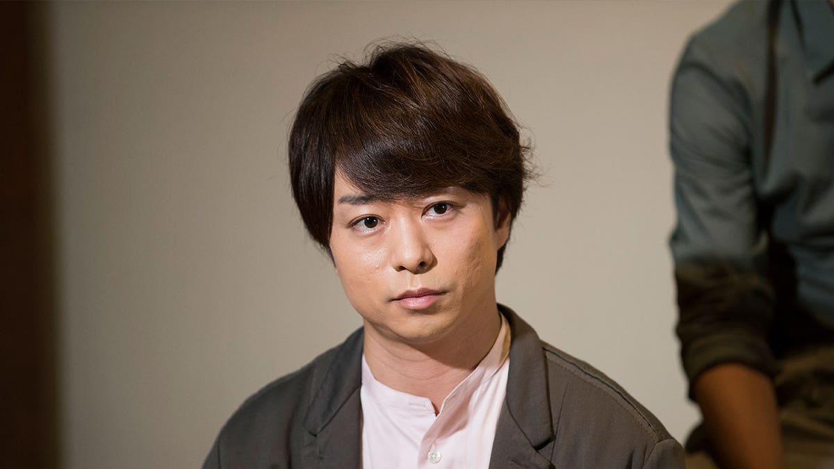Japanese man listens