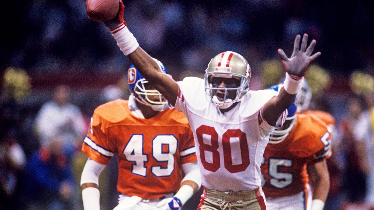 Jerry Rice celebrates a touchdown