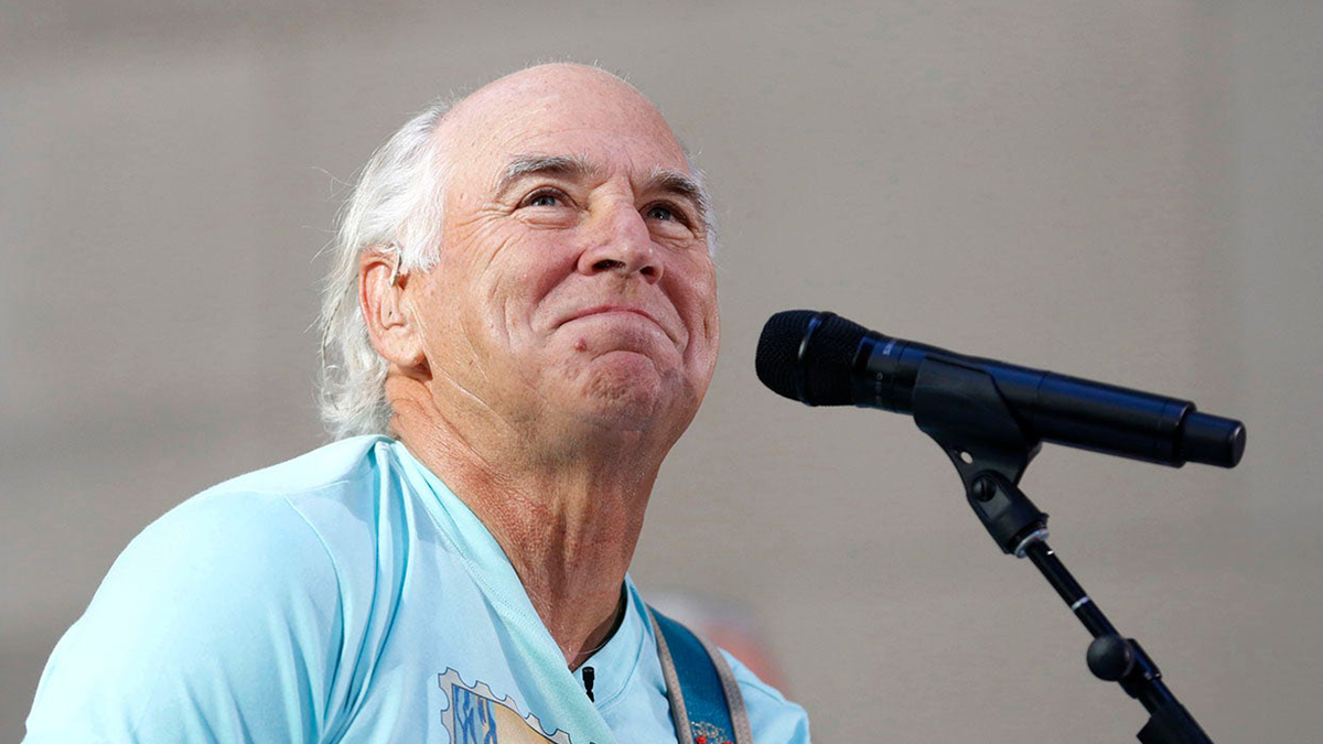 Jimmy Buffett next to microphone