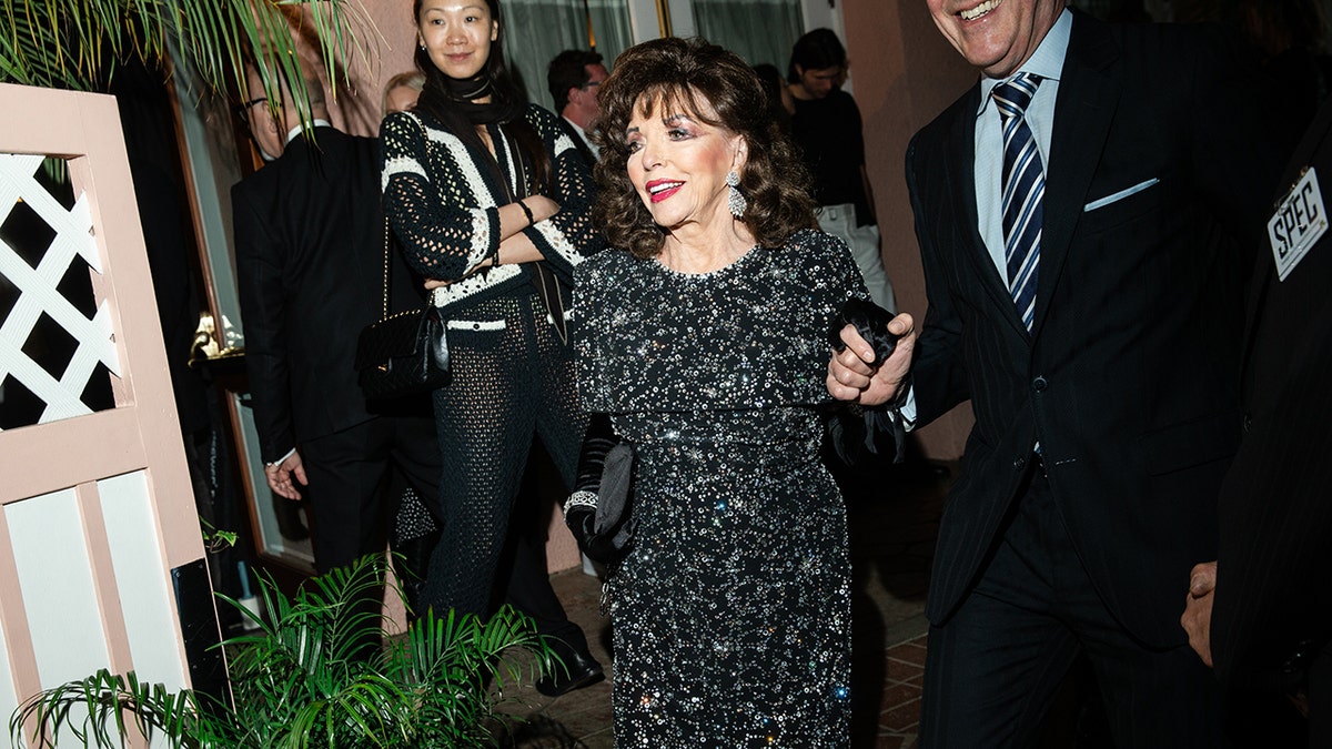 Joan Collins in a designer dress