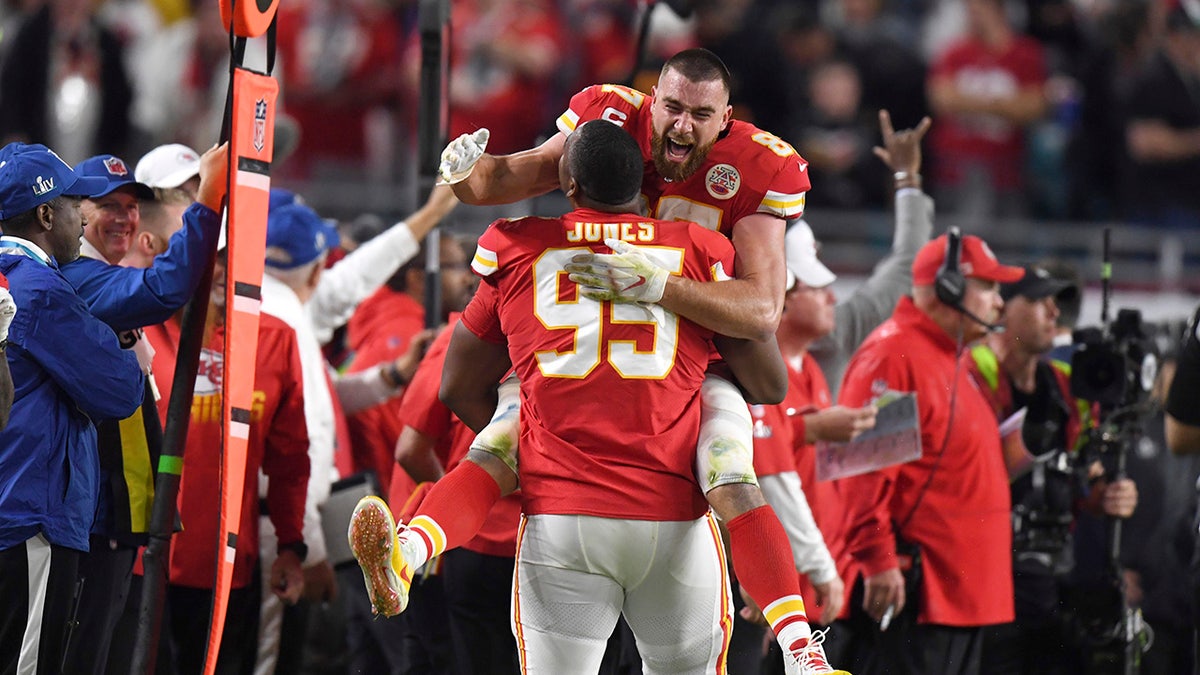 Travis Kelce hugs Chris Jones