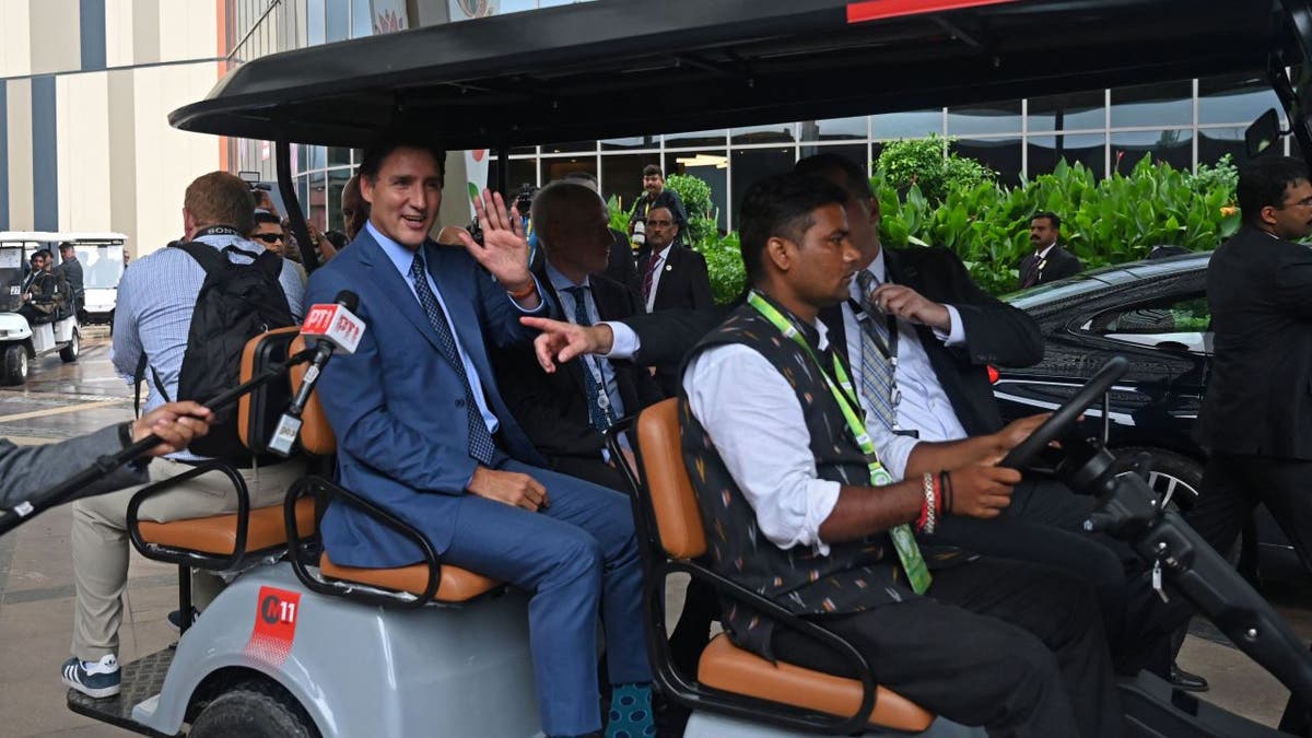 Trudeau waving from cart