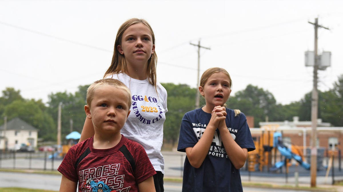 kids in front of school