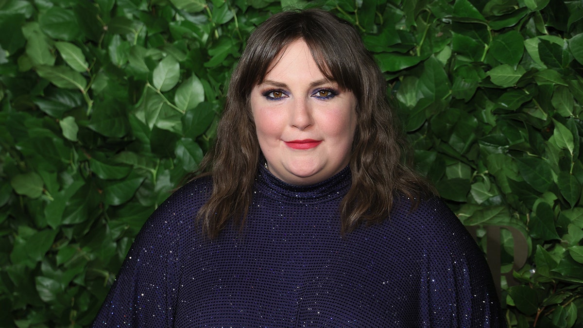 Lena Dunham in a blue sparkly dress on the carpet in New York City