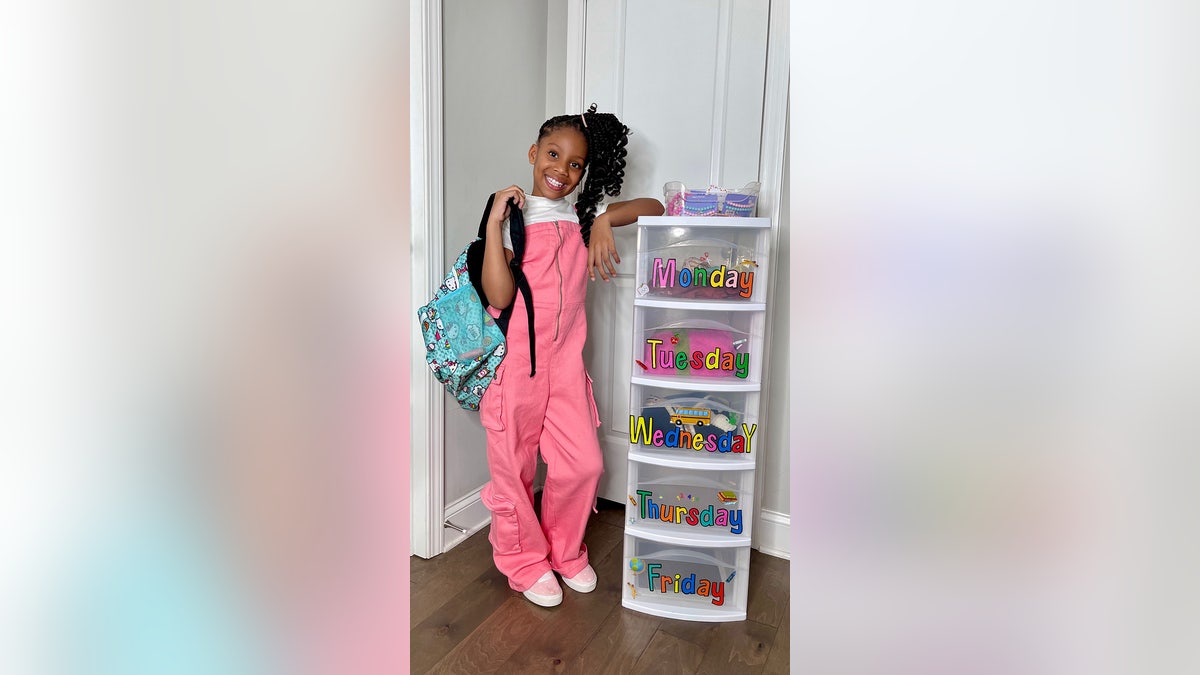 londyn with outfit bins