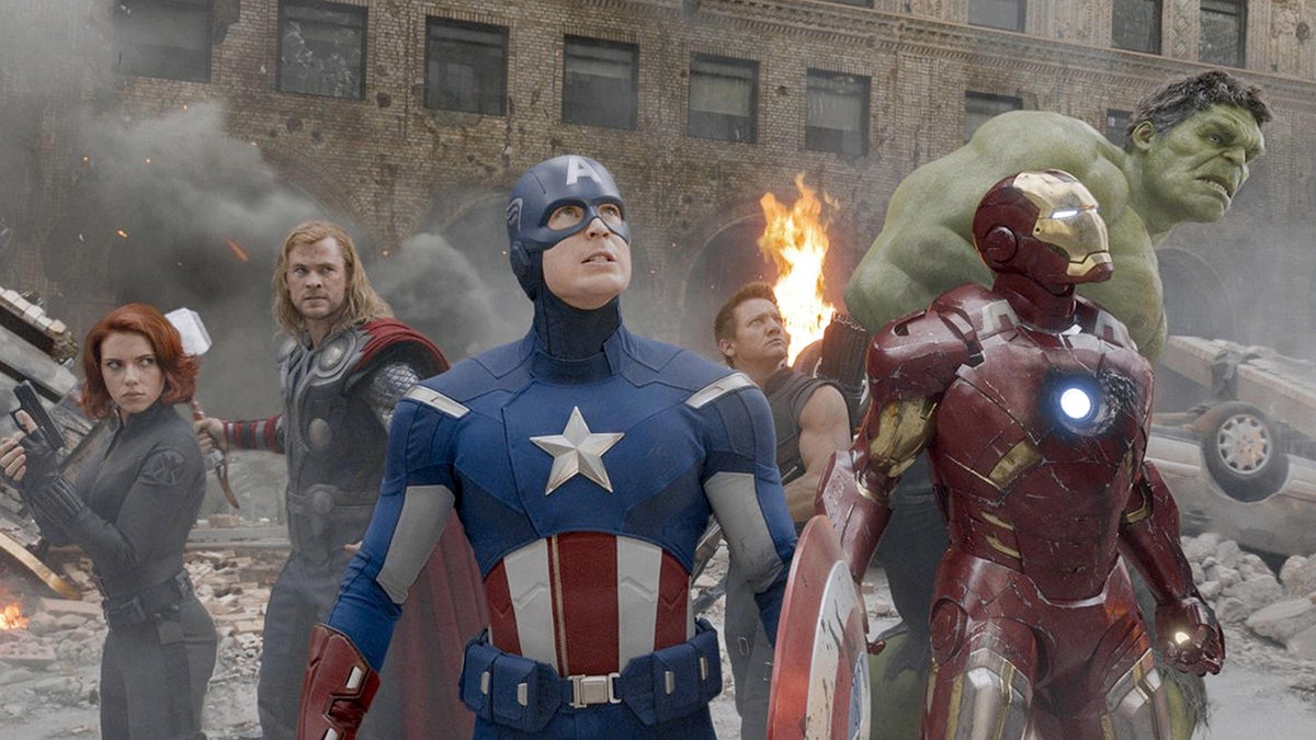 Chris Evans as 'Captain America' looks up in the sky as he is surrounded by other Avengers including Black Widow (Scarlett Johansson), Thor (Chris Hemsworth), Hawkeye (Clint Barton), Iron Man (Anthony Stark) and The Incredible Hulk (Mark Ruffalo)