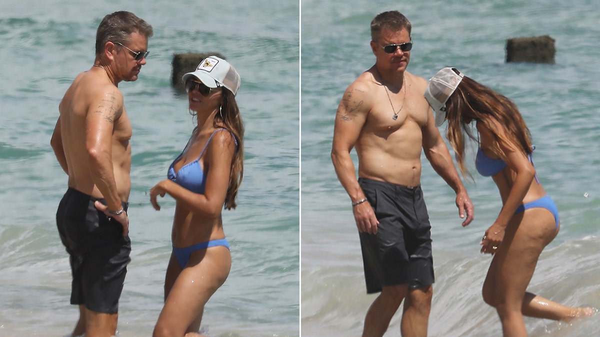 Matt Damon in dark swim trunks looks at his wife in a blue bikini split Matt Damon looks at his wife in the water