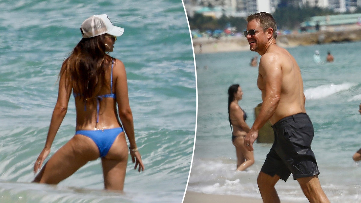 Luciana Barroso with her back to the camera shows off her body in a blue bikini split Matt Damon walks out of the water 