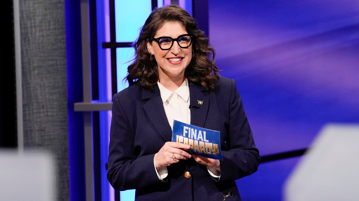 A photo of Mayim Bialik hosting "Jeopardy"