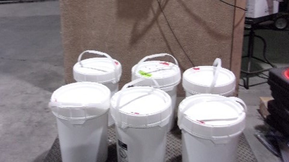 Customs officials seize 140 pounds of meth hidden in paint containers 