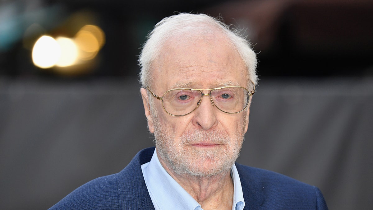 Michael Caine wearing glasses