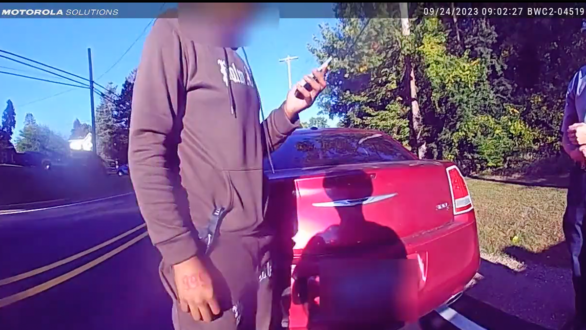 Michigan suspect checking phone