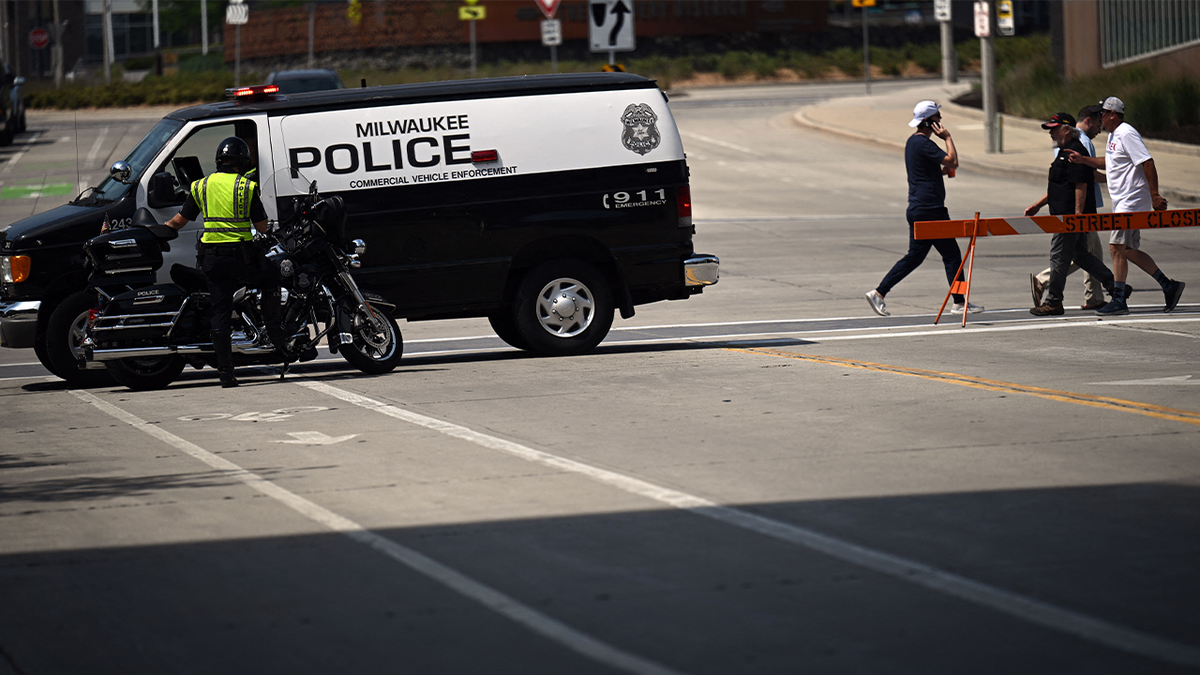 Milwaukee police van on road