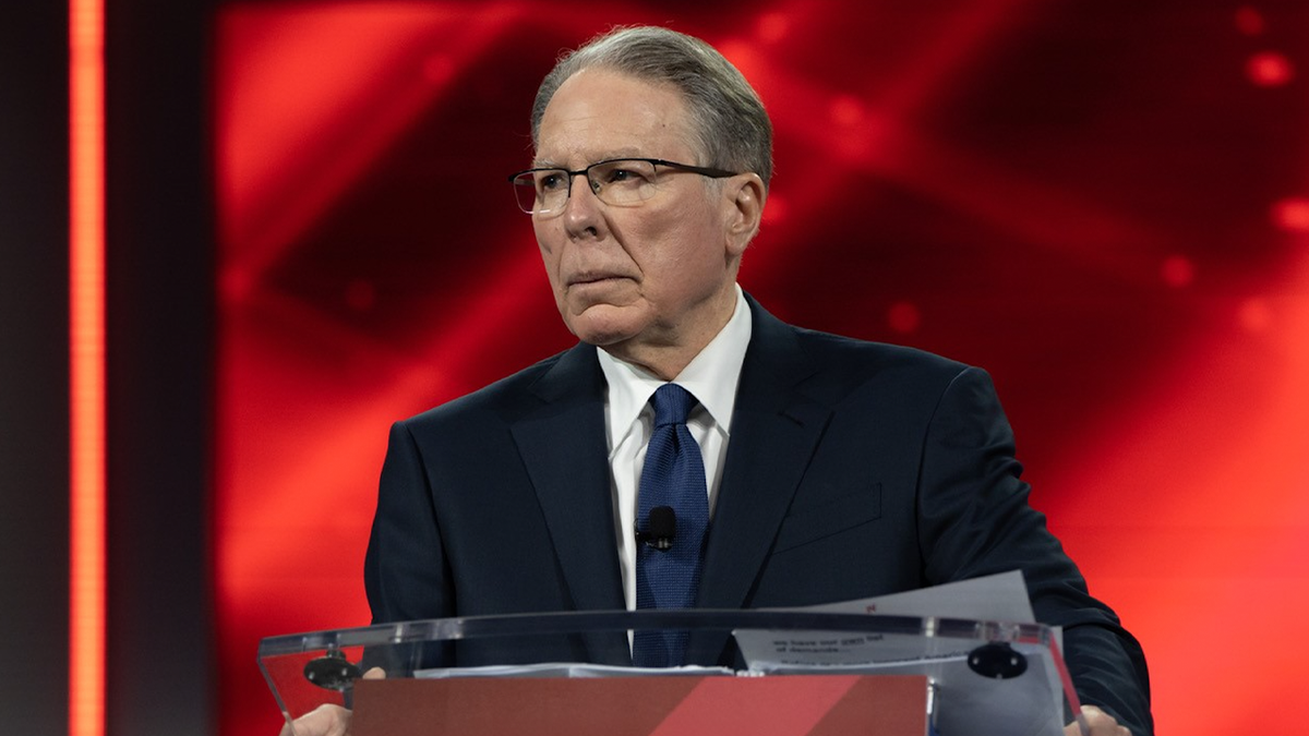 Wayne LaPierre at podium with red background