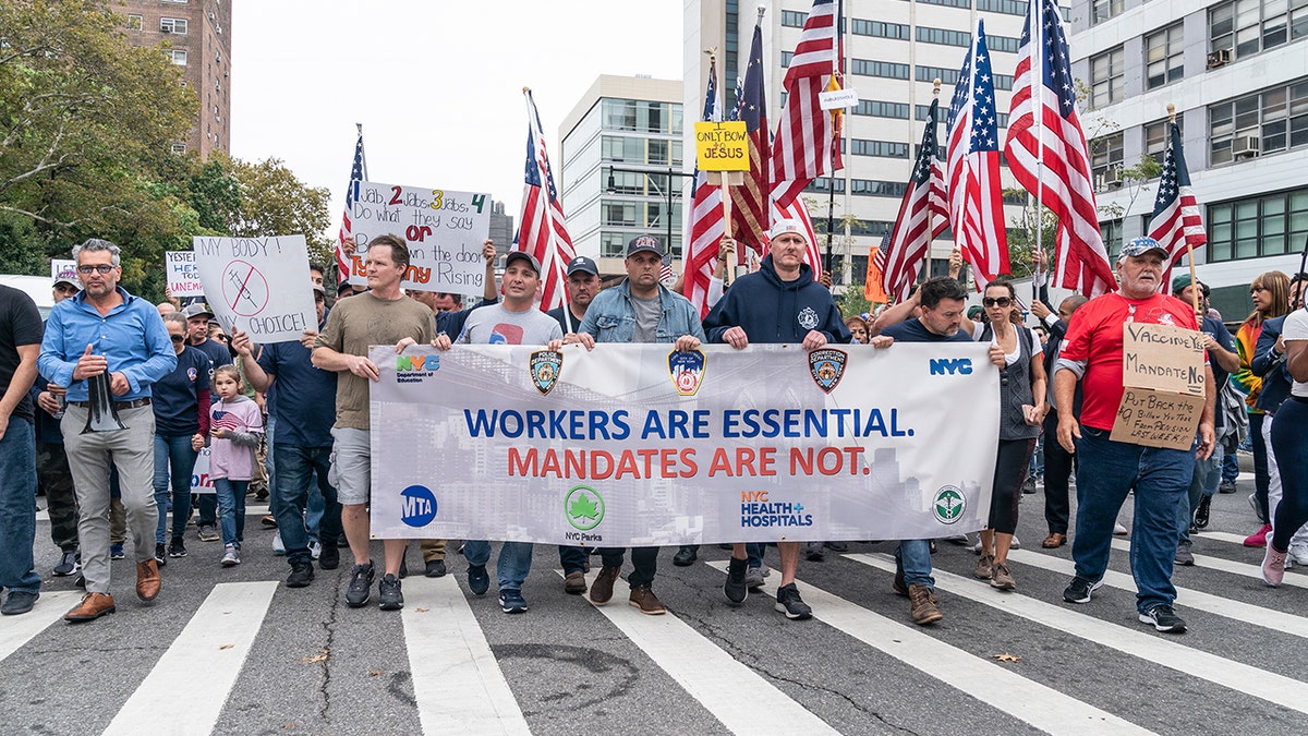 NYC Municipal workers protest vaccine mandate on Brooklyn Bridge