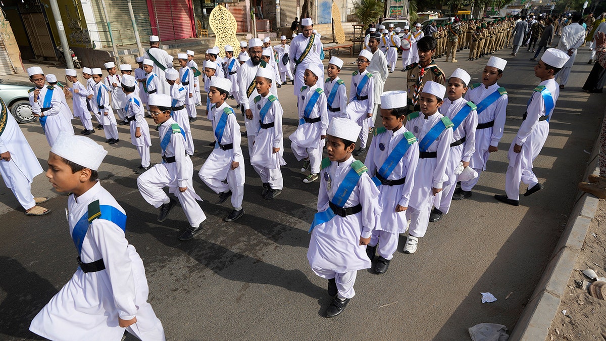 Children parade at rally celebrating the birthday of Islam's Prophet Muhammad