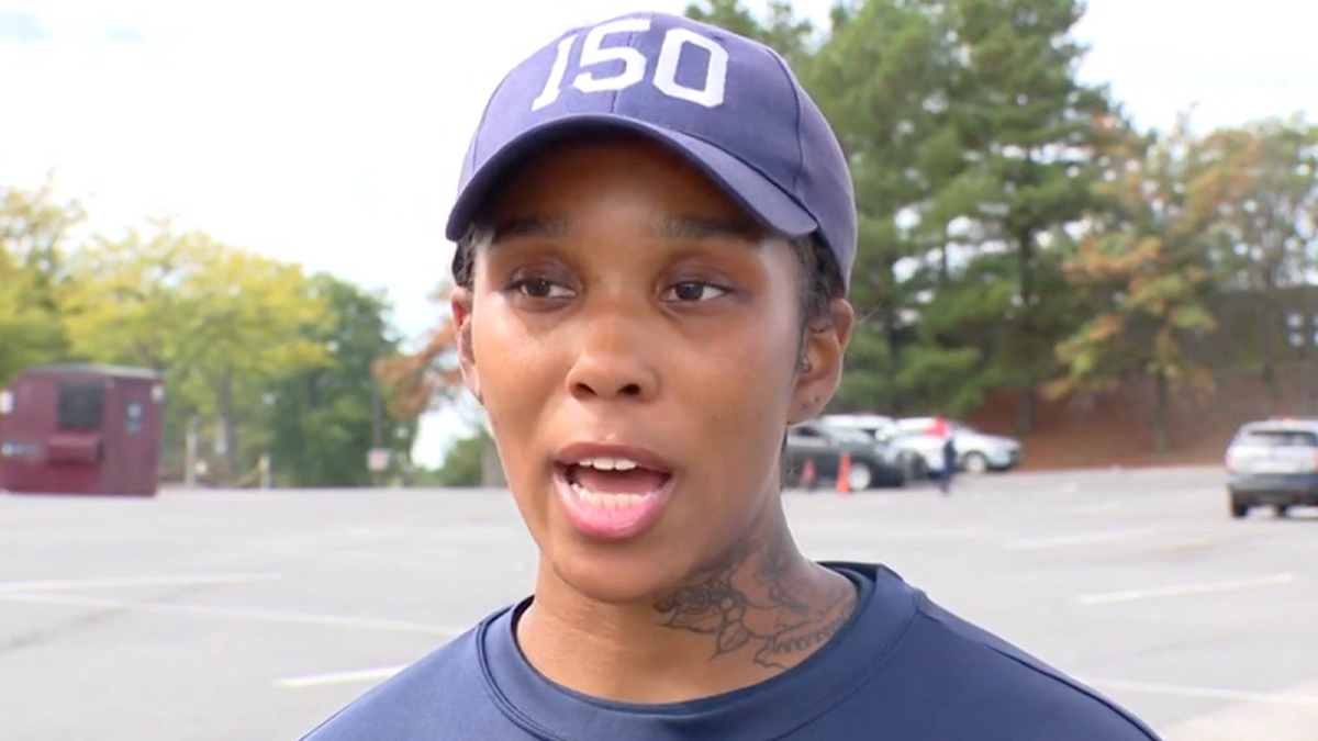 Police recruit in blue t-shirt, ball cap