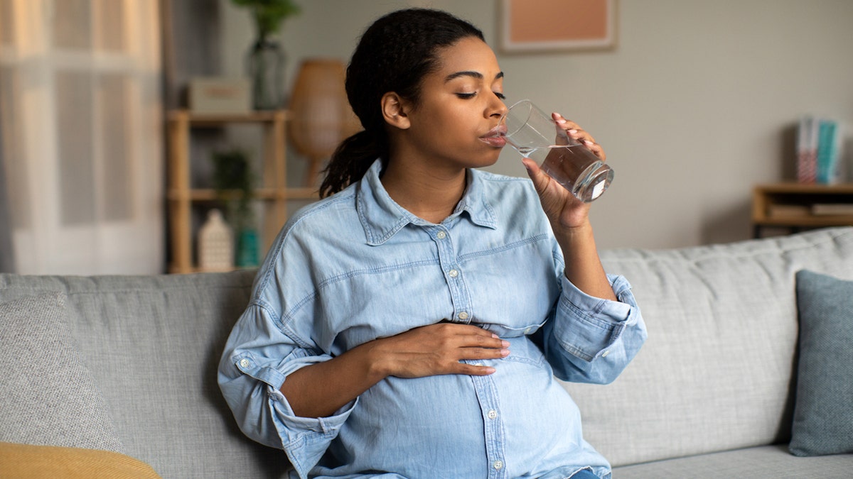 Pregnant woman drinking water