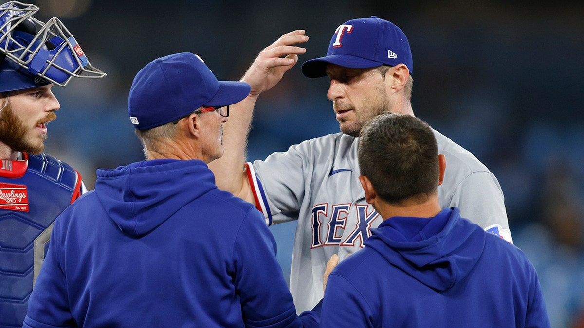 Max Scherzer with trainer