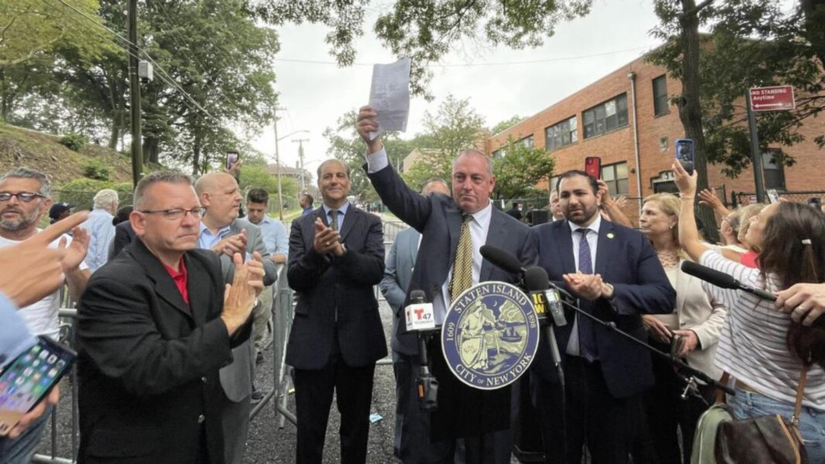 Staten Island Borough President Vito Fossella and other officials celebrate court order
