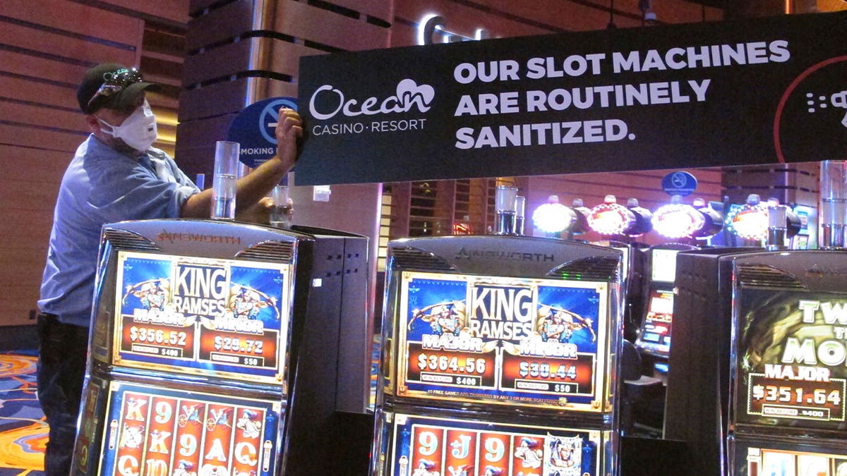 man puts up sign in casino