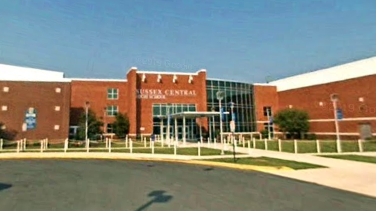 Delaware high school seen from parking lot in Google 