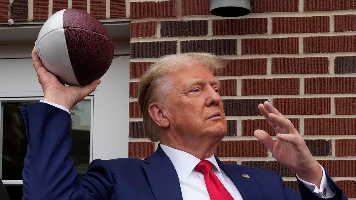 Trump throwing football