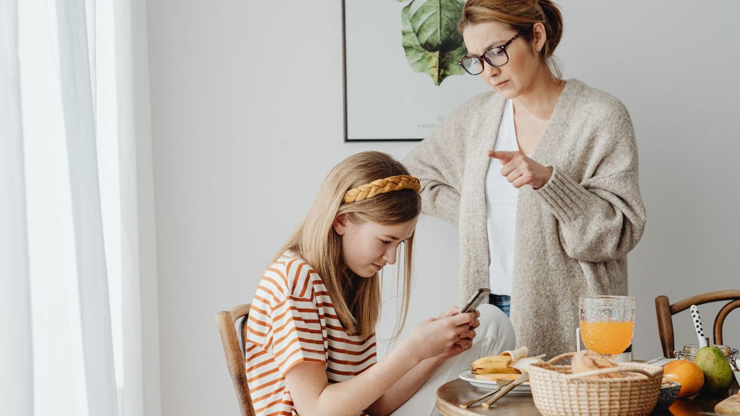 3 MOM AND KID ON PHONE