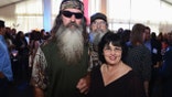 Phil Robertson posing with Kay Robertson