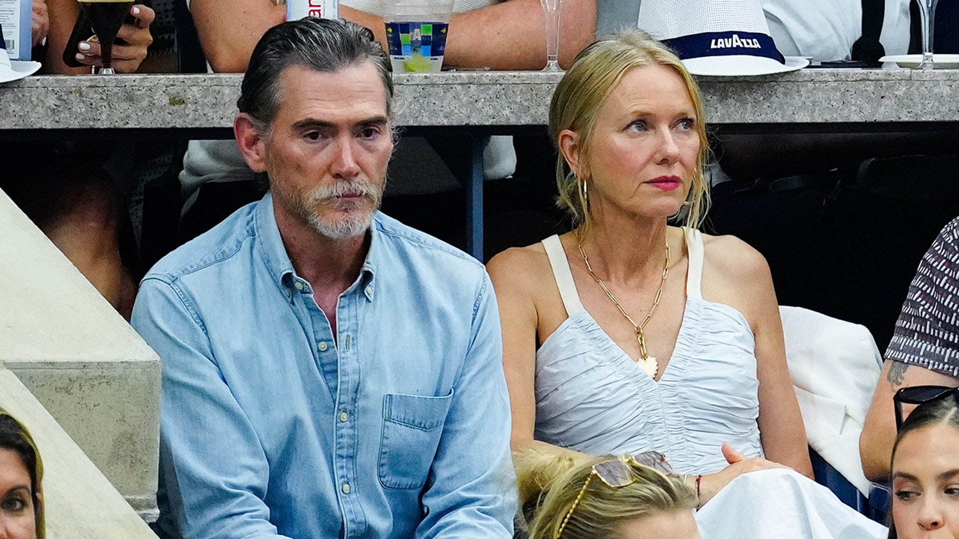Naomi Watts wears white dress alongside Billy Crudup in denim shirt