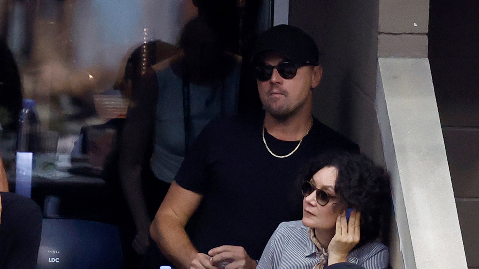 US Open fans Leonardo DiCaprio and Sara Gilbert share a box at tennis match