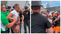 Handcuffed Bengals fan in Zubaz overalls knocks out fan with vicious headbutt