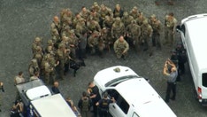 Fugitive team poses for group photo after capturing bloody escaped killer
