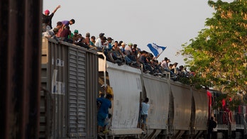 Mexico railway halts train operations after viral video showing migrants riding to the US