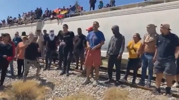 Mexican train with hundreds of migrants onboard stopped, passengers chant, 'Let us continue'