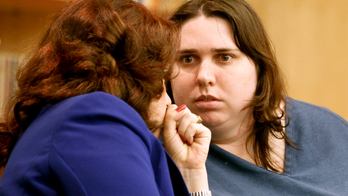 California judge rejects woman's claim she was following masters' orders in killing of Marine's wife