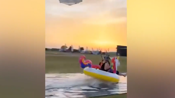 Daredevil skydiver makes perfect landing on bizarre pool toy: 'Coming for ya'