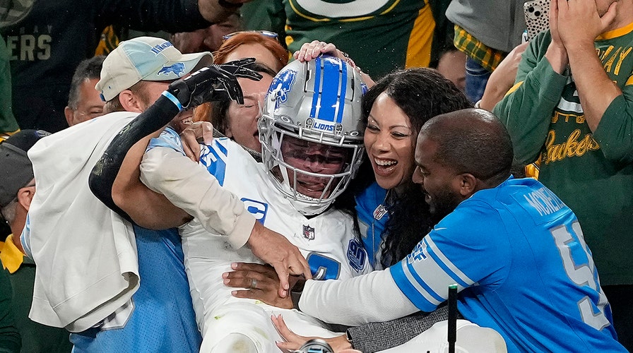 Lions' Amon-Ra St Brown met with beer shower upon Lambeau Leap