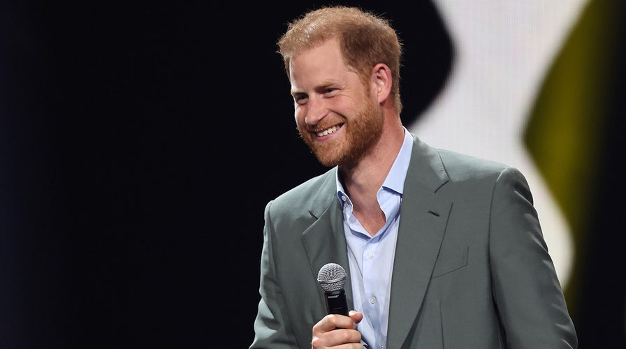 Prince Harry surprises fan at Heart of Invictus screening