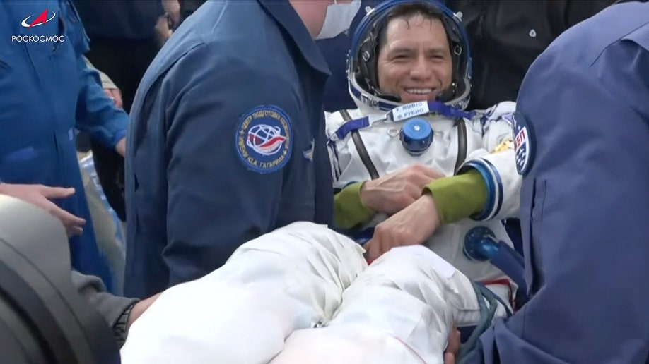 NASA astronaut Frank Rubio carried after landing