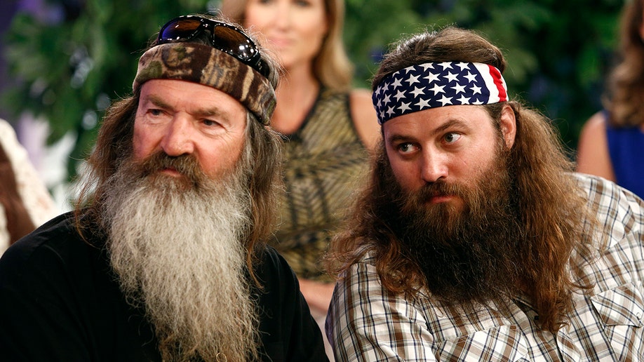 Phil Robertson con su hijo Willie Robertson