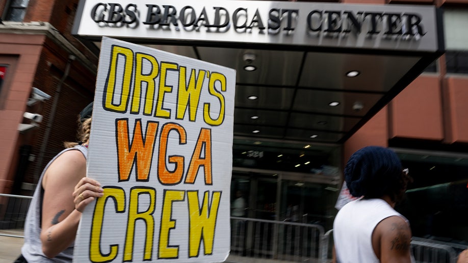 Members of the WGA-EAST and SAG-AFTRA picket outside of The Drew Barrymore Show
