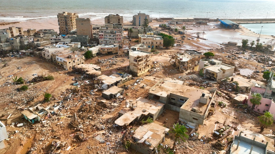 Searchers race to recover bodies in Libya as death toll from flooding hits 5,100