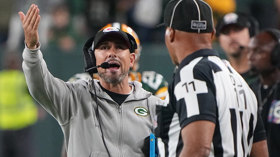 Green Bay Packers head coach Matt LaFleur looks on from the