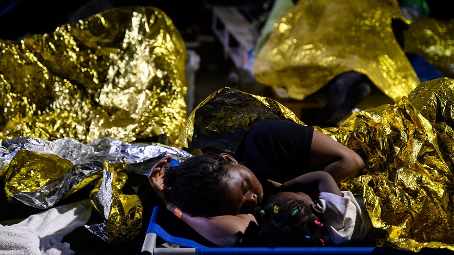 Tiny Italian island overwhelmed with thousands of migrants who arrived within 24 hours