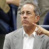 Jerry Seinfeld sports a grey blazer with wife Jessica Seinfeld at US Open