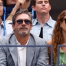 Jon Hamm sports grey suit with wife Jenny Osceola in green dress at US Open tennis match