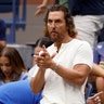 Matthew McConaughey wears white T-shirt and jeans at US Open tennis match