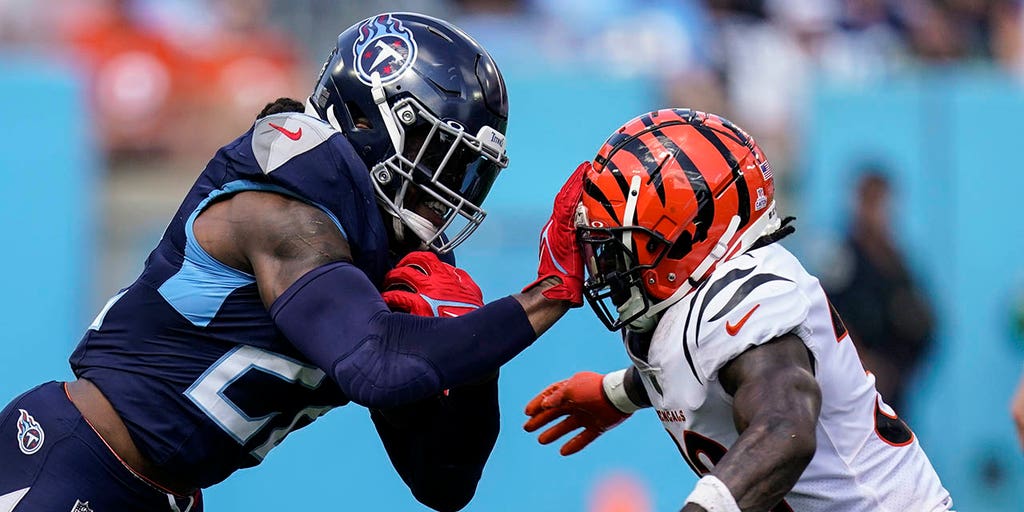 Titans' Derrick Henry runs over Bengals defense, throws TD pass in big win